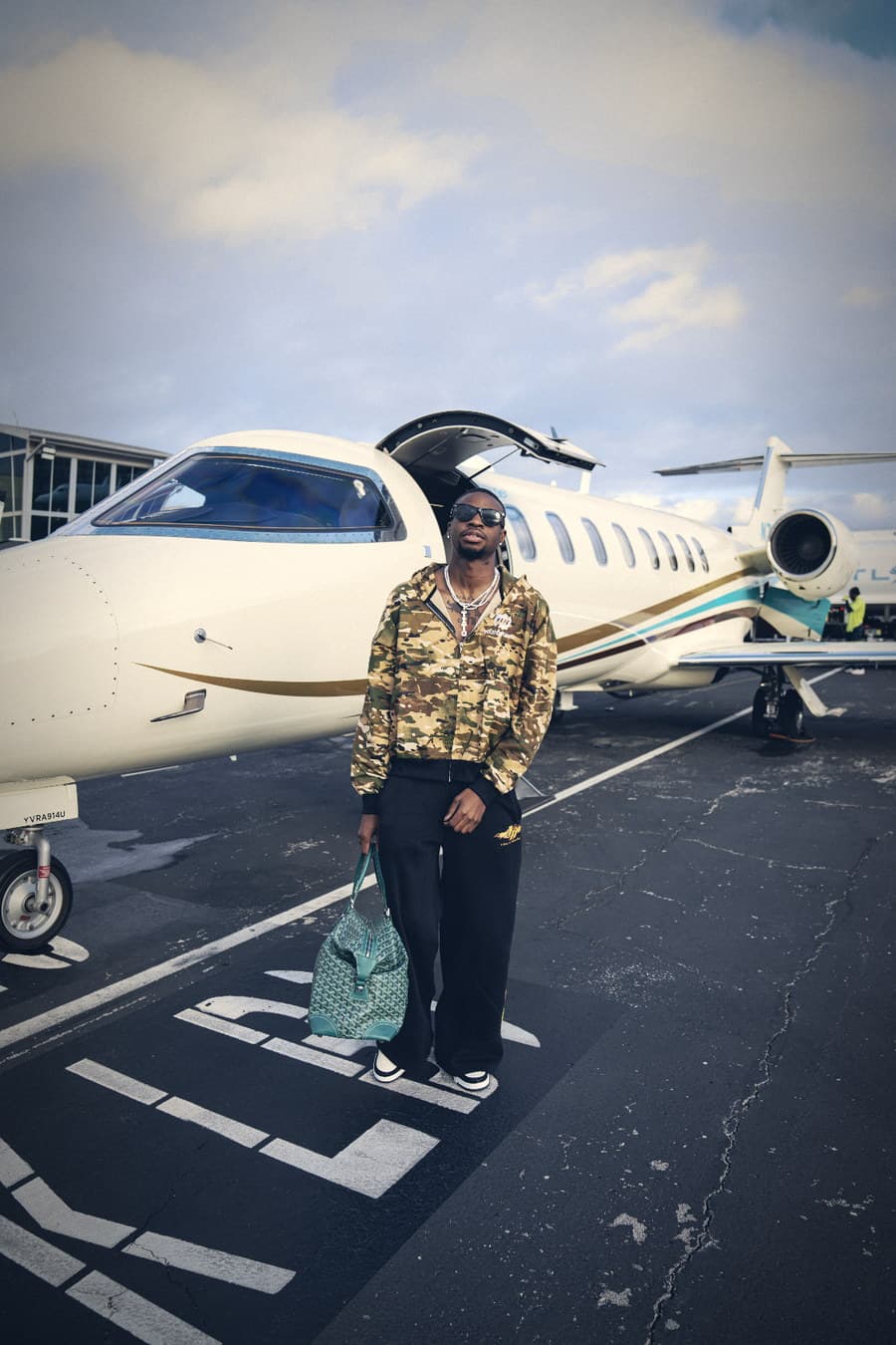 Tito Durojaye beside the jet, Houston
